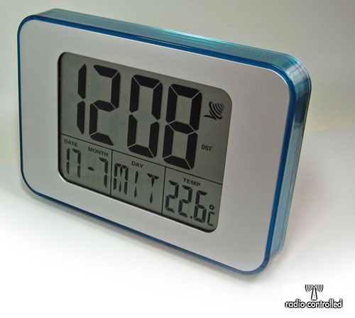 Elegante Funkwanduhr Türkis Wanduhr Uhr Funkuhr Tischuhr LCD Wecker Funkwecker - Bild 1 von 1